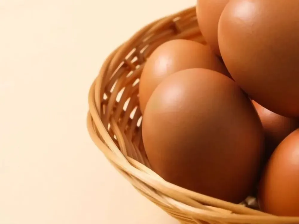 Brown eggs in a woven basket